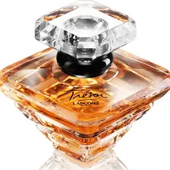 Eleganckie perfumy damskie Trésor Lancôme, ikona lat 90. Bursztynowy płyn w kryształowym flakonie.