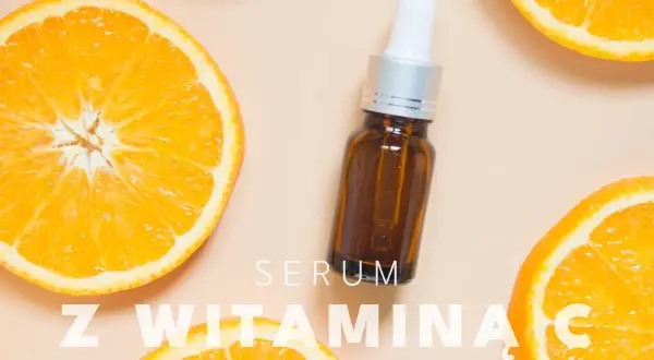 Serum z witaminą C na twarz, otoczone soczystymi plastrami pomarańczy.
